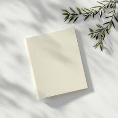 Poster - Blank book with soft shadow and green leaves on white background