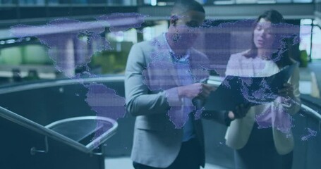 Poster - Business professionals discussing over digital world map animation in modern office