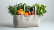 © Kenny Parker - A tote bag with a variety of fresh produce like fruits and vegetables on a simple white background showcasing health-conscious food