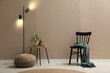 © New Africa - Stylish room interior with pouf, chair and houseplants