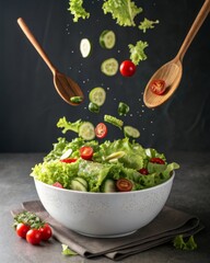 Poster - A vivid image of a fresh salad being prepared, with ingredients flying into a large bowl.