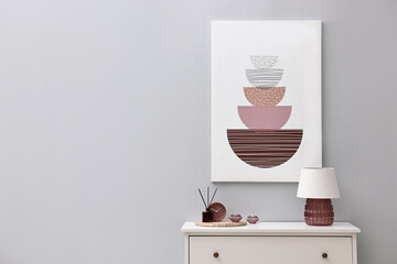 Poster - Console table with lamp, clock reed diffuser and candles near light grey wall, space for text. Interior design