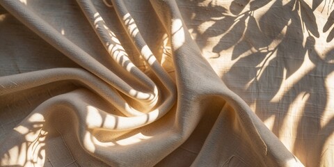 Poster - Beautifully draped fabric casting intricate shadows from nearby foliage in warm natural light
