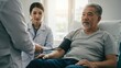 © Qbertstudio - Asian nurse assists elderly Asian man during blood pressure check in doctor's office Diversity, healthcare, patient care