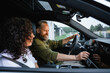 © DZ FILM/Stocksy - A man and a woman in a car