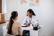 © Evgeniia Siiankovskaia/Stocksy - A woman at a consultation with a gynecologist in a private clinic.