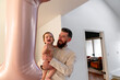 © Christine La/Stocksy - Dad baby balloon