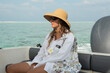 © Alina Hvostikova/Stocksy - Relaxing on a boat ride in clear turquoise waters during the day