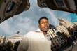 © Jimena Roquero/Stocksy - Fisheye. Modern portrait of man in Madrid city street