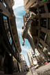 © Jimena Roquero/Stocksy - Fisheye angle of man jumping in city street in sunlight