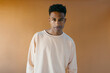 © Jimena Roquero/Stocksy - Studio portrait of young handsome man looking at camera