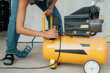 © Alina Hvostikova/Stocksy - Skilled builder repairs equipment in a construction space