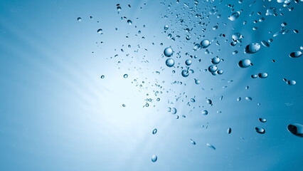 Poster - Bubbles ascend gracefully through clear blue water as sunlight filters in from above, creating a tranquil and serene atmosphere within the aquatic landscape. 3d render