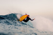 © Adrian Rodd/Stocksy - Expert surfer doing a reentry on the crest of a huge wave