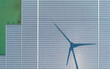 Floating Solar Farm With Wind Turbine Shadow Aerial Drone View