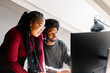 © Adrian Rodd/Stocksy - Black female supervisor gives feedback to a co-worker