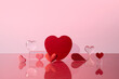 © Marc Tran/Stocksy - Assorted Red Hearts on Reflective Surface With Pink