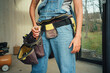© Alina Hvostikova/Stocksy - Crop woman builder preparing for construction repairs in a workshop