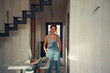 © Alina Hvostikova/Stocksy - Woman builder working on home renovations in modern space