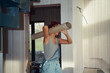 © Alina Hvostikova/Stocksy - Builder working on construction repair project in a home