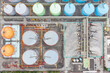 © Lawren Lu/Stocksy - Aerial View of Industrial Tanks and Piping System in Facility