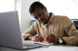 © Jovo Jovanovic/Stocksy - Serious businessman using marker at desk in office
