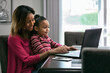 © Sean Locke/Stocksy - Home: Little Girl Wants To Help While Mother Works From Home