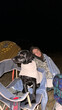 © Alina Hvostikova/Stocksy - Camping under the stars in Svaneti, Georgia with a loyal dog