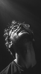 Poster - A man wearing glasses is photographed in black and white