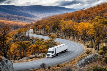 Poster - A large rig navigating a serpentine highway amidst mountainous terrain