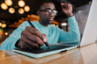 © VICTOR TORRES/Stocksy - Creative professional using tablet and laptop in modern workspace