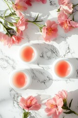 Aufkleber - Close-up of pink flowers and lip balms on a marble surface, great for beauty or lifestyle photoshoots