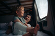 © Santi Nuñez/Stocksy - Mother and child inside a camper van looking out the window