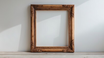 Poster - Elegant vintage wooden frame with intricate carvings positioned centrally against a bright white wall, with soft shadows enhancing its details.