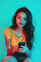 Poster - A woman sits on a chair and gazes at her cell phone, possibly checking messages or browsing
