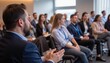 © Worldwide - Professional Audience Engaged in Business Seminar with Focus on Learning and Collaboration