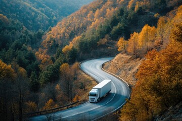 Poster - A truck drives down a winding mountain road with scenic views