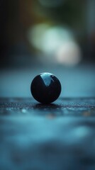 Poster - A single black stone sits atop a table, with no surrounding context