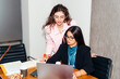 © Lucas Ottone/Stocksy - Junior executives working at their desk