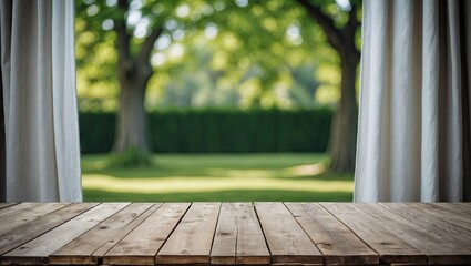 Poster - Wooden tabletop in foreground with sheer white curtains on either side, revealing lush green trees and a manicured lawn in a serene outdoor setting.