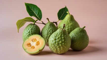 Poster - Fresh guavas on a soft pastel background with vibrant green leaves arranged alongside whole and sliced fruit showcasing texture and color.