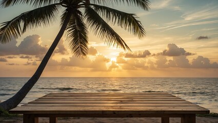 Poster - Empty wooden table in the foreground with a golden sunset sky and silhouetted palm tree to the side creating ample copy space for text or design.