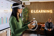 © VICTOR TORRES/Stocksy - Asian woman in interactive e-learning session with VR headset