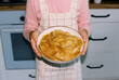 © Evgeniia Siiankovskaia/Stocksy - Portrait of girl holding a plate with hot pancakes at home.