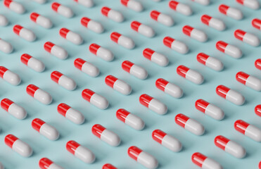 White and red pills in rows on a light blue background.
