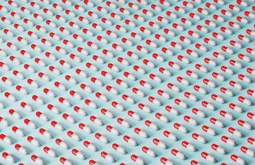 Pills in rows on a light blue background.