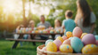 © kokoson6 - family enjoys sunny outdoor picnic with colorful Easter eggs in basket
