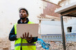 © Ezequiel Giménez/Stocksy - A building inspector assesses the damage at a construction site