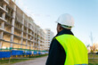 © Ezequiel Giménez/Stocksy - Construction manager inspecting the building's development