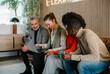 © VICTOR TORRES/Stocksy - Collaborative business meeting with diverse team using a laptop